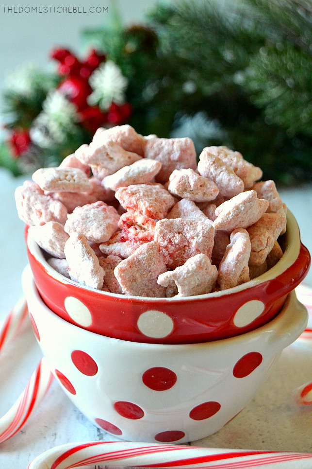 Red and white bowl of peppermint candy cane muddy buddies