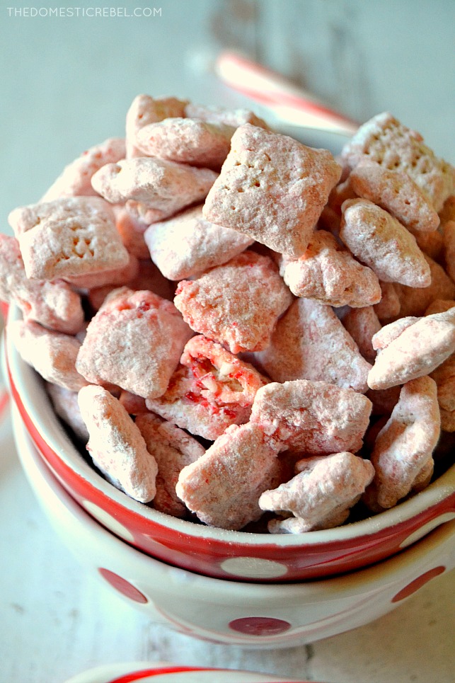 Closeup cluster of peppermint muddy buddies in a red bowl